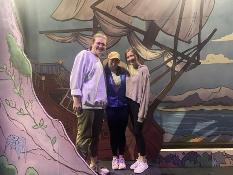 Isaac Knudsen on left, McKenzie Russ in the middle and Beth Anderson on the right, standing on set for “Pirates of Penzance” 