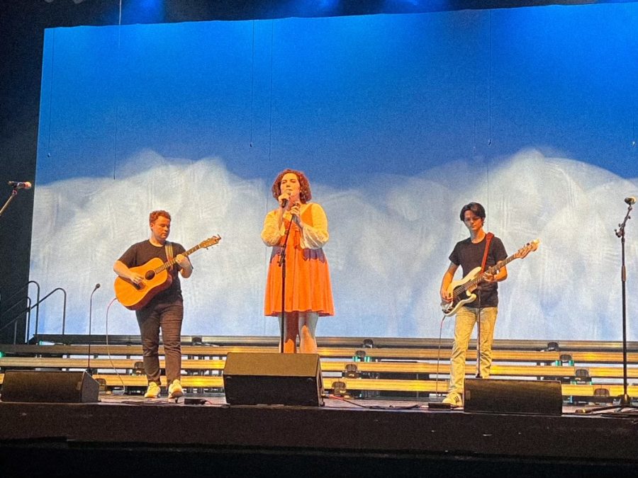 Caption: “Phase Three” band members, Jake Aune [left], Sophie La Fave [center], and Spencer Curtis [right] perform their latest single, “I Found You.” 