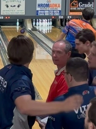 Coach Dunnum gives bowling team a pep talk 